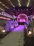 the caves wedding ceremony floral arch and lanterns