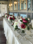 castle suite wedding breakfast floral posies on top table