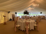 pink chiffon drapes with floral centrepieces