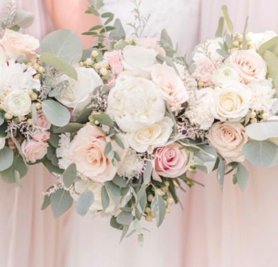 Three floral bouquets featuring pale pink and white roses with greenery accents.